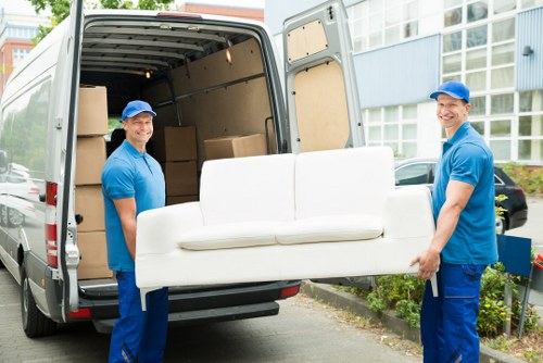 Team member reviewing ethical compliance documents for Bromley Man And Van