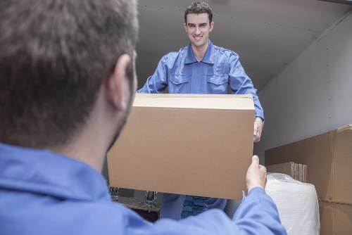 Professional packing team preparing boxes in a Bromley home