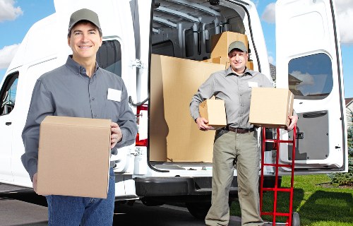 Driver and helper managing a move in Bromley residential street